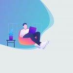 a guy working on a laptop with a plant next to him